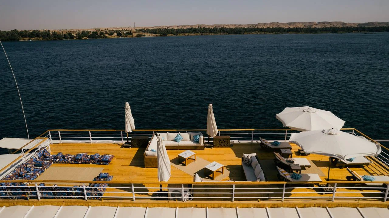 Expansive 70m² Sky Roof terrace on Soul of the Nile Dahabiya featuring sun loungers and panoramic Nile views