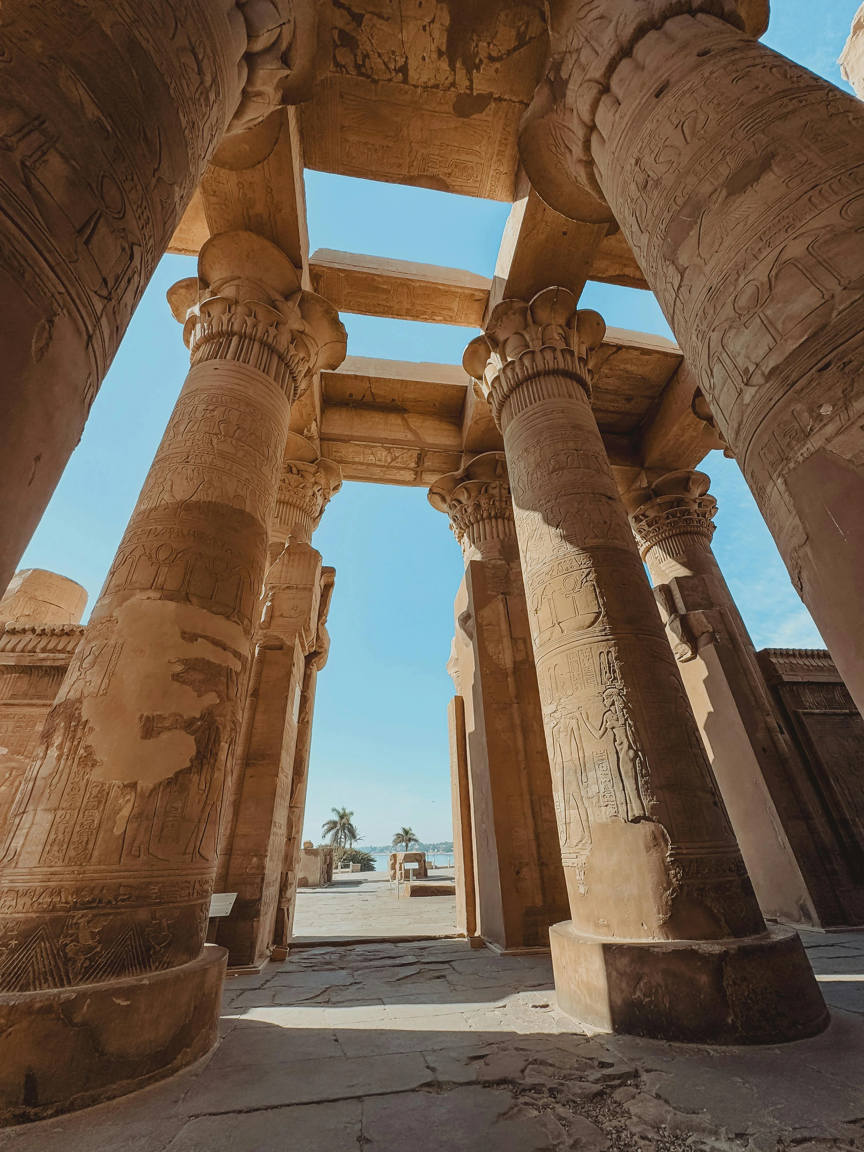 The majestic, symmetrical architecture of the ancient Kom Ombo Temple overlooking the Nile River.